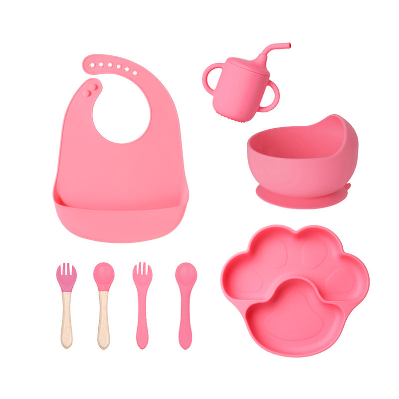 Dark pink 8-piece baby feeding set with a bib, a sippy cup, a bowl, four utensils and a bear paw plate