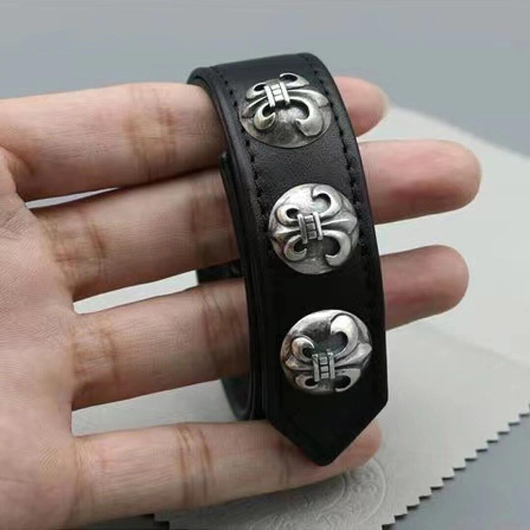Black leather concho cuff bracelet shown on the move in a daily setting