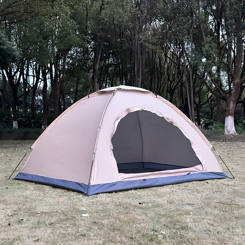 Double layer camping tent packed into its carry sack beside the folded poles