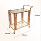 Gold serving cart parked against a wall showing its 85 by 45 by 87 cm open frame