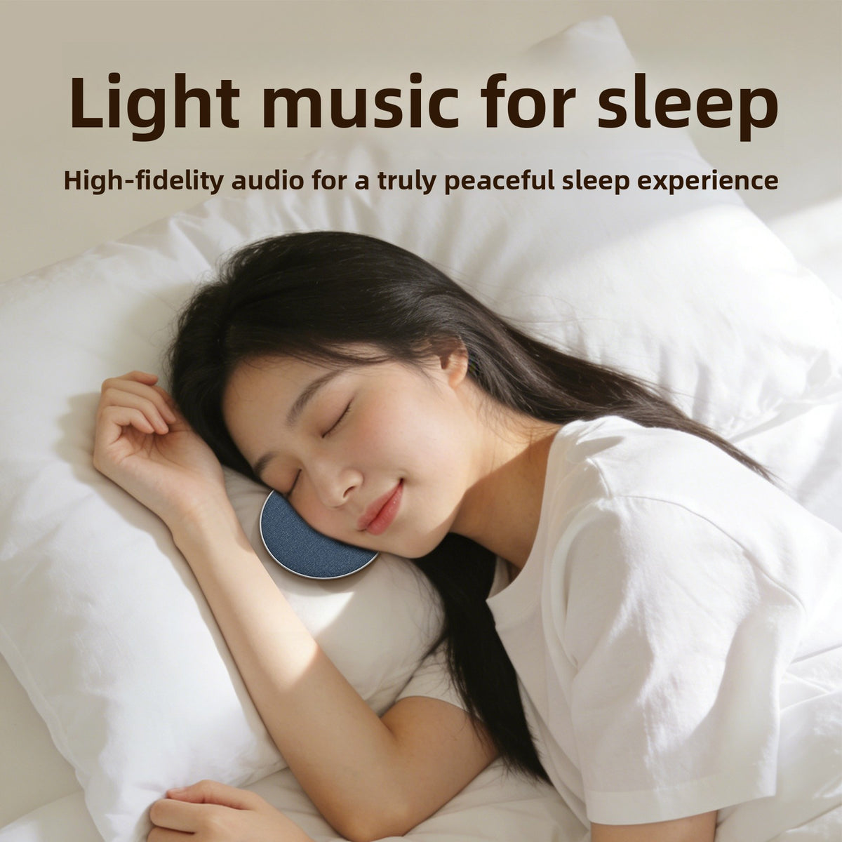 Woman lying on a white pillow with the blue round speaker resting beside her face, banner light music for sleep