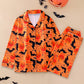 Orange Pumpkin Bat pajama set with black bats and pumpkin faces, size L option photo