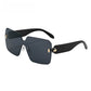 One piece rimless shield lens sunglasses with bevel cut edges and gold toned hinges