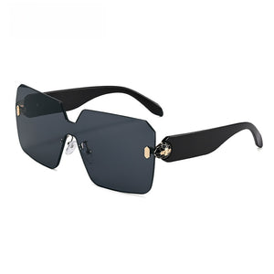 One piece rimless shield lens sunglasses with bevel cut edges and gold toned hinges