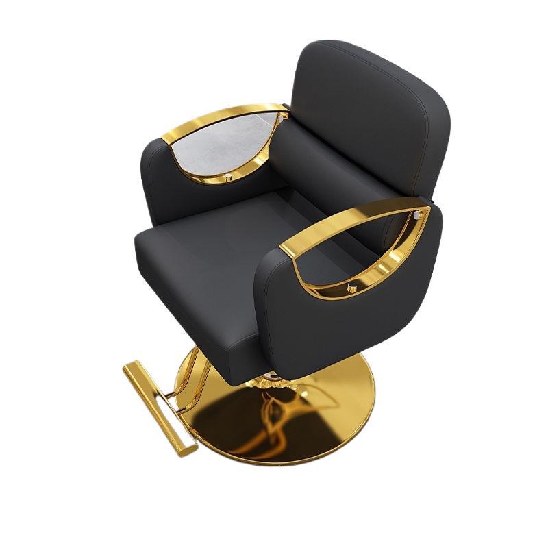 Salon styling chair shown from the side with its footrest and hydraulic swivel base