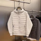 Grey and black hooded jackets side by side showing the padded front and knit sleeves