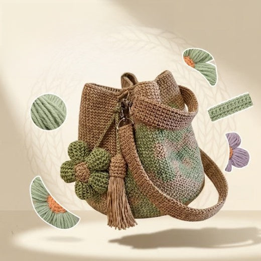 Green crochet cotton bucket bag with a flower charm and tassel on a soft studio background