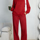Red fleece hooded sweatshirt and wide-leg sweatpants set worn by a model