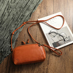 Reference image of the retro leather shoulder bag showing colour options and carry detail