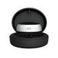 Silver throat pulse device seated inside its open round black charging case