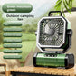Green camping fan with an oscillating head and remote control on the base