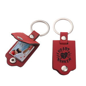 Side profile of the PU leather keychain showing the metal hook clasp and strap edge