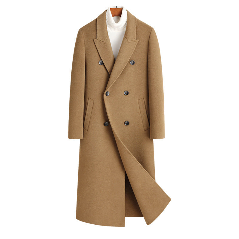 Camel double breasted long wool blend coat on a wooden hanger over a white roll neck, front view