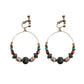 Handmade bohemian clip-on earrings with tassel and bead drop detail, zinc alloy frame, studio shot on white background