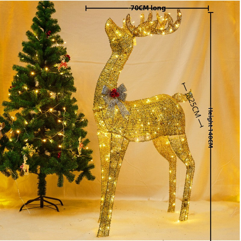 Golden lit reindeer beside a Christmas tree, 140 cm tall, 70 cm long and 25 cm wide on the maker's drawing, extended variant