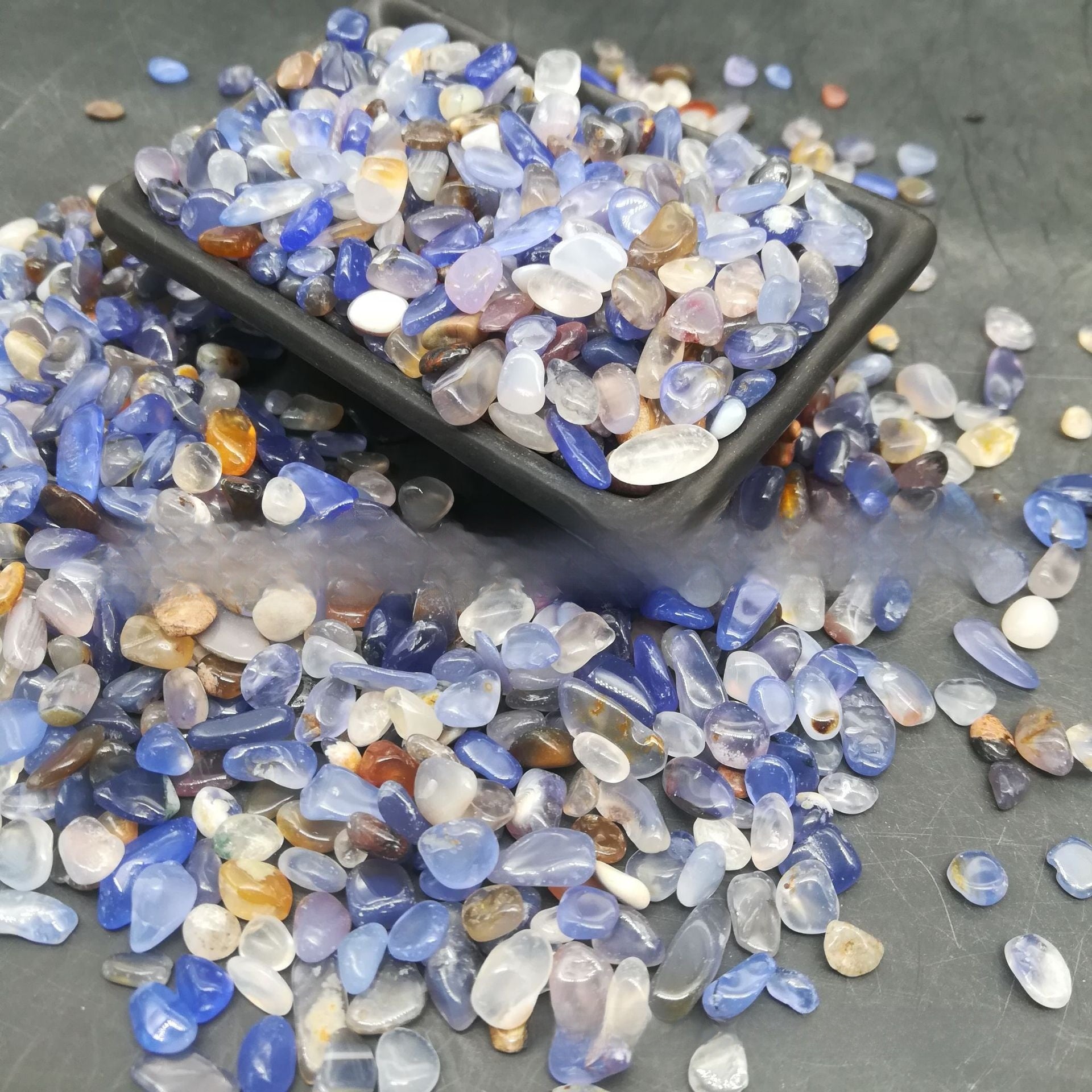 Turquoise look tumbled stones with matrix veins in a decorative lot