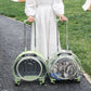 Two rolling bubble pet carriers, green and clear, with a cat inside and a woman holding both pull rods