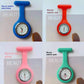 Purple silicone nurse fob watch with a quartz analog dial and inner seconds ring