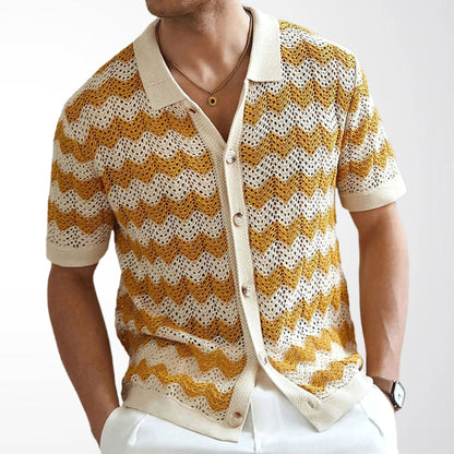 Man wearing yellow and cream open knit ripple polo shirt with buttons half open