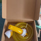 Pet shower hose connector shown next to its color box packaging
