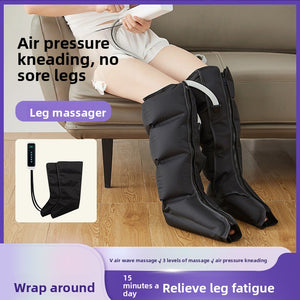 Black inflatable leg wrap worn on a sofa with the wired handset alongside