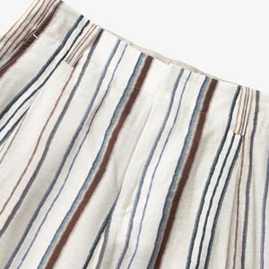 Close view of high waistband and belt loops on the striped wide leg pants