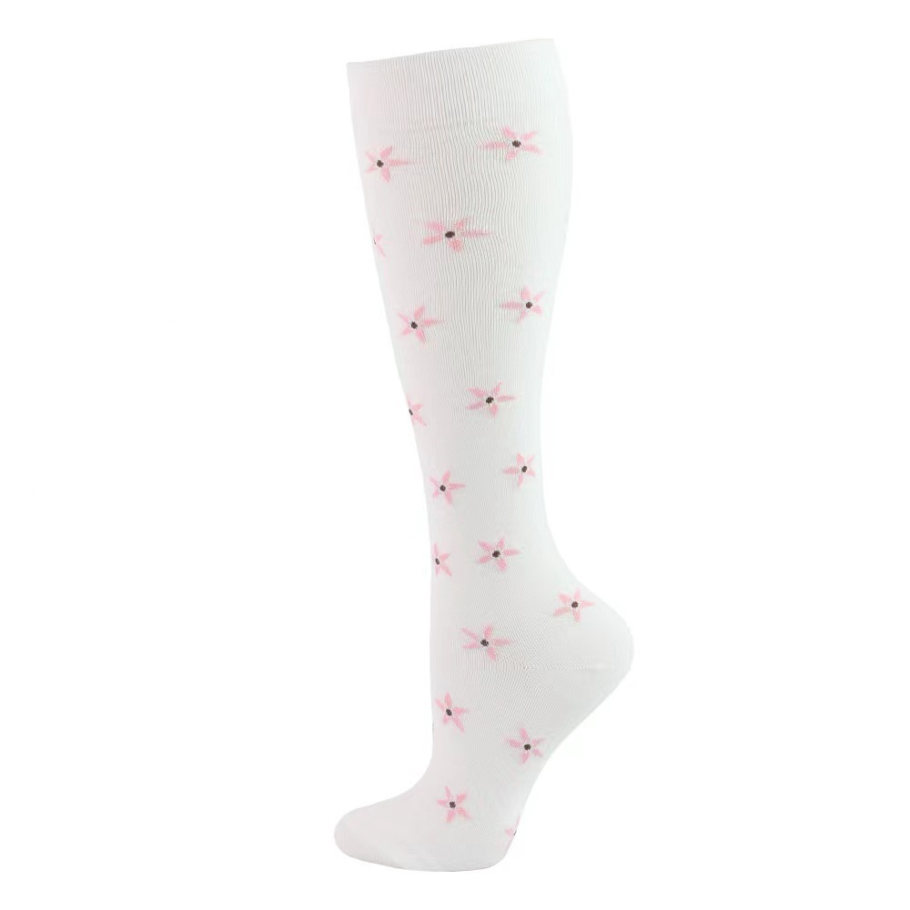 White knee-high compression sock with pink five-pointed flowers, size L/XL, on a white background