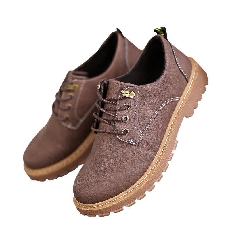 Pair of brown low-top lace-up derby shoes with rope style laces and a lugged rubber sole on a white background