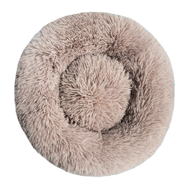 Light gray round plush pet bed with a raised bolster rim on a plain background