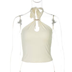 Apricot halter crop top front view with gold O-ring at the neckline and keyhole cutout