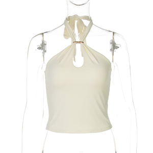 Apricot halter crop top front view with gold O-ring at the neckline and keyhole cutout