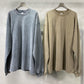 Ribbed crew neck and distressed collar detail of the dark blue washed long tee