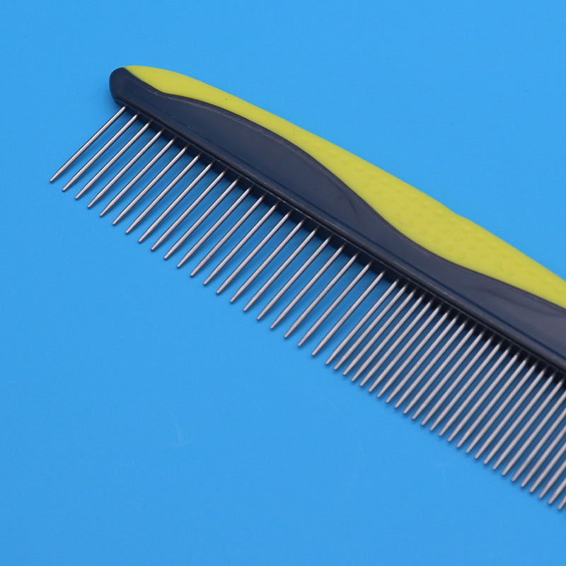 Row of rounded stainless steel pins on a pet grooming comb
