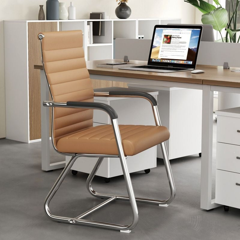 Low back tan khaki leather cantilever conference chair, latex seat, fixed armrests and chrome frame in an office