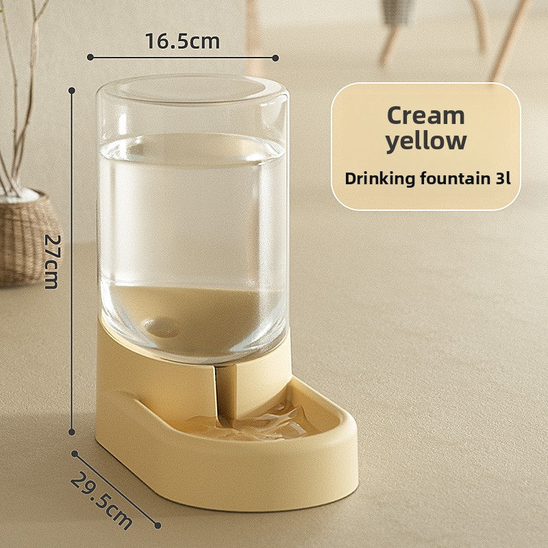 Gray gravity pet feeder combo with water and food reservoirs on a floor