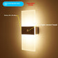 LED wall sconce switched on with a warm white up and down glow