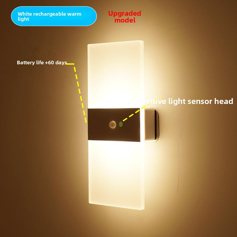 LED wall sconce switched on with a warm white up and down glow