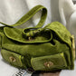 Olive green option: olive suede shoulder bag with a flap, front twist lock pockets and a long strap