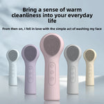 Handheld silicone facial cleansing brush with a soft bristle head and an ergonomic handle