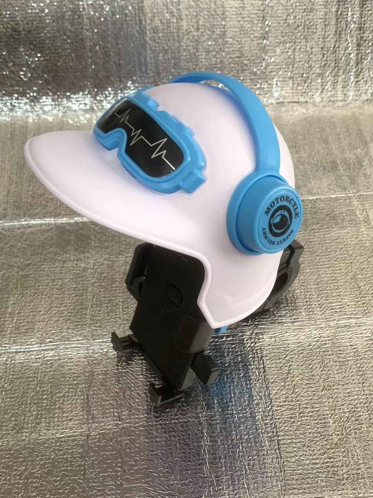 Handlebar with helmet, white option: white small helmet visor over a phone holder on a handlebar clamp