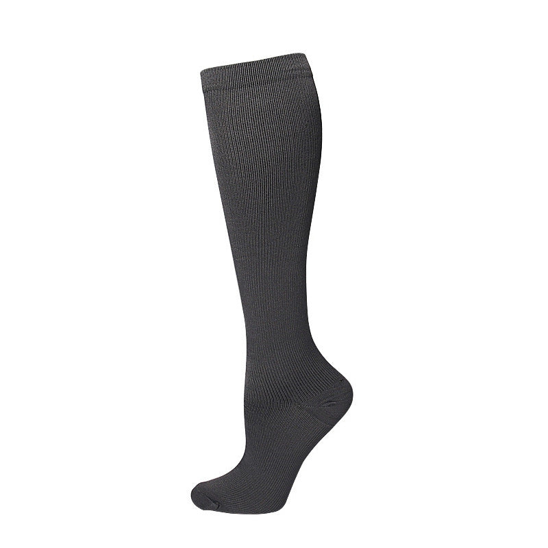 White mid calf sport sock displayed flat with the silicone grip visible on the sole