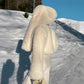 Curly plush faux fur jacket body shown close up to reveal the soft synthetic pile