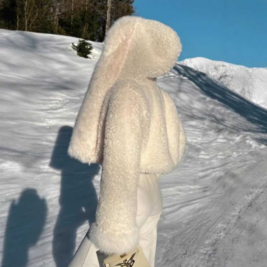 Curly plush faux fur jacket body shown close up to reveal the soft synthetic pile