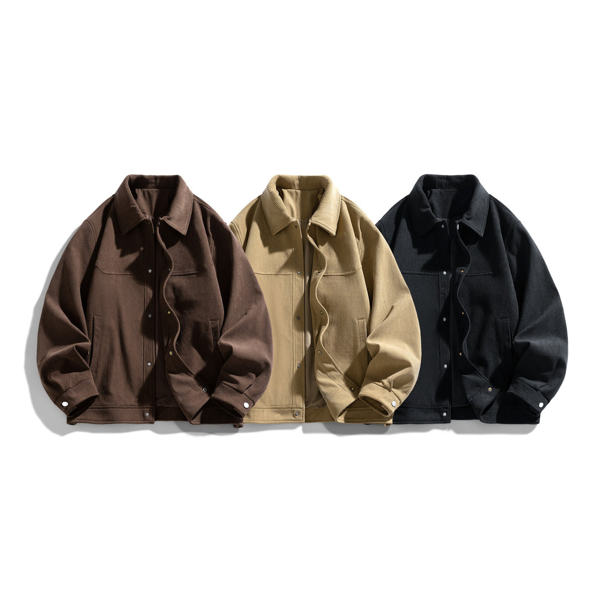 Three button front jackets in coffee brown, khaki and black laid out together on white