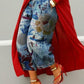 Wide leg cropped light blue denim jeans with boat scene and cream bloom print, red coat and heels