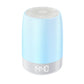 White baby night light speaker glowing soft blue with a digital clock reading on the lit base