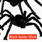 Hairy black Halloween spider prop with red eyes, flocked body and eight posable bendable legs