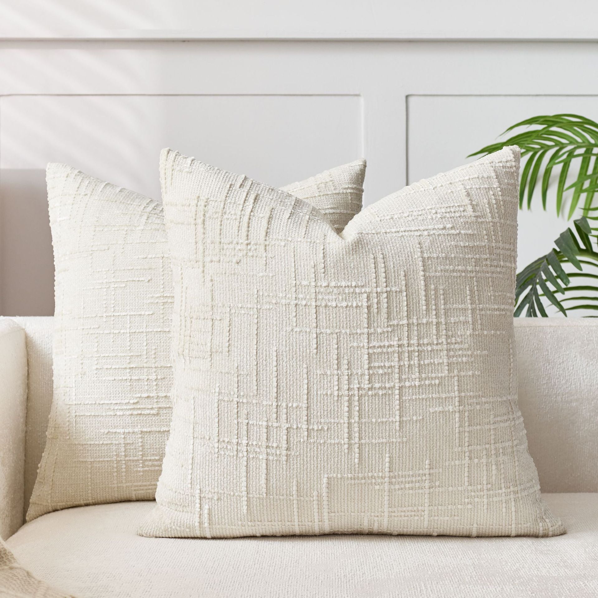 Soft chenille pillow cover in a single solid tone, its tufted crosshatch weave catching the light on the surface