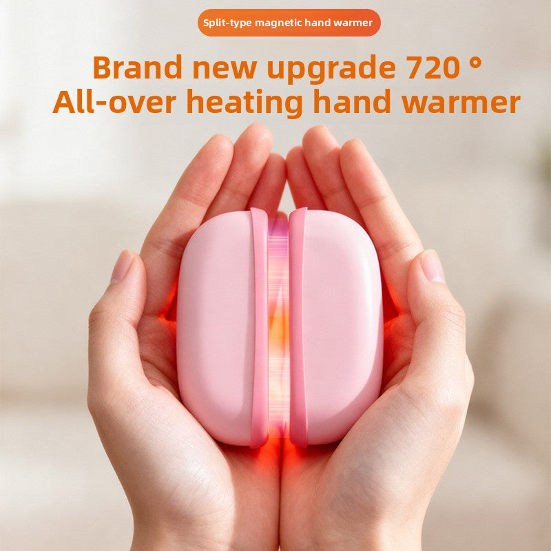 Pink split magnetic hand warmer held in both hands with a warm glow showing at the magnetic seam