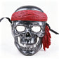 Antique silver pirate skull mask with red fabric bandana tail and black ribbon ties
